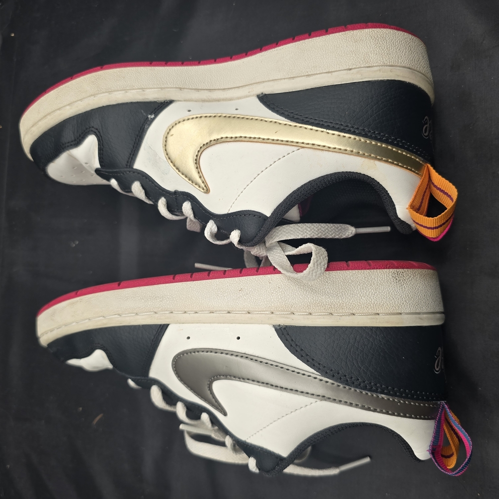 Nike Black and White Sneakers with Gold Swoosh